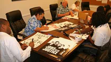 Preparing signs for Labor Day March in Dallas